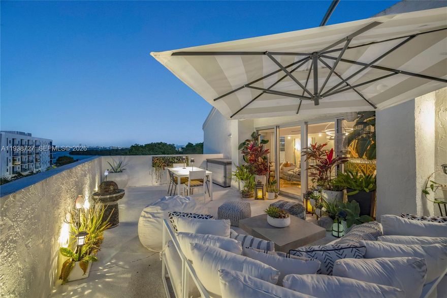 Discover limitless possibilities in this one-of-a-kind Nirvana Penthouse Compound. Perched high above the shimmering waters of Biscayne Bay, this “duplex” is really two homes in one, created by uniting two separate fully-renovated two-bedroom corner units through ~700 SF of expansive rooftop terraces into one sprawling, dual-wing, four-bedroom, four-ensuite bathroom private retreat, with two kitchens, two laundry rooms, and a total of 2,147 SF of combined living areas. Great for multi-generational living, live-work compound, in-law quarters, inspiring home office, nanny suite, or lucrative rental income. With its unique “separate, yet connected” combined two-unit format, this exclusive residence occupies the building’s entire NE corner, offering panoramic garden and bay views.