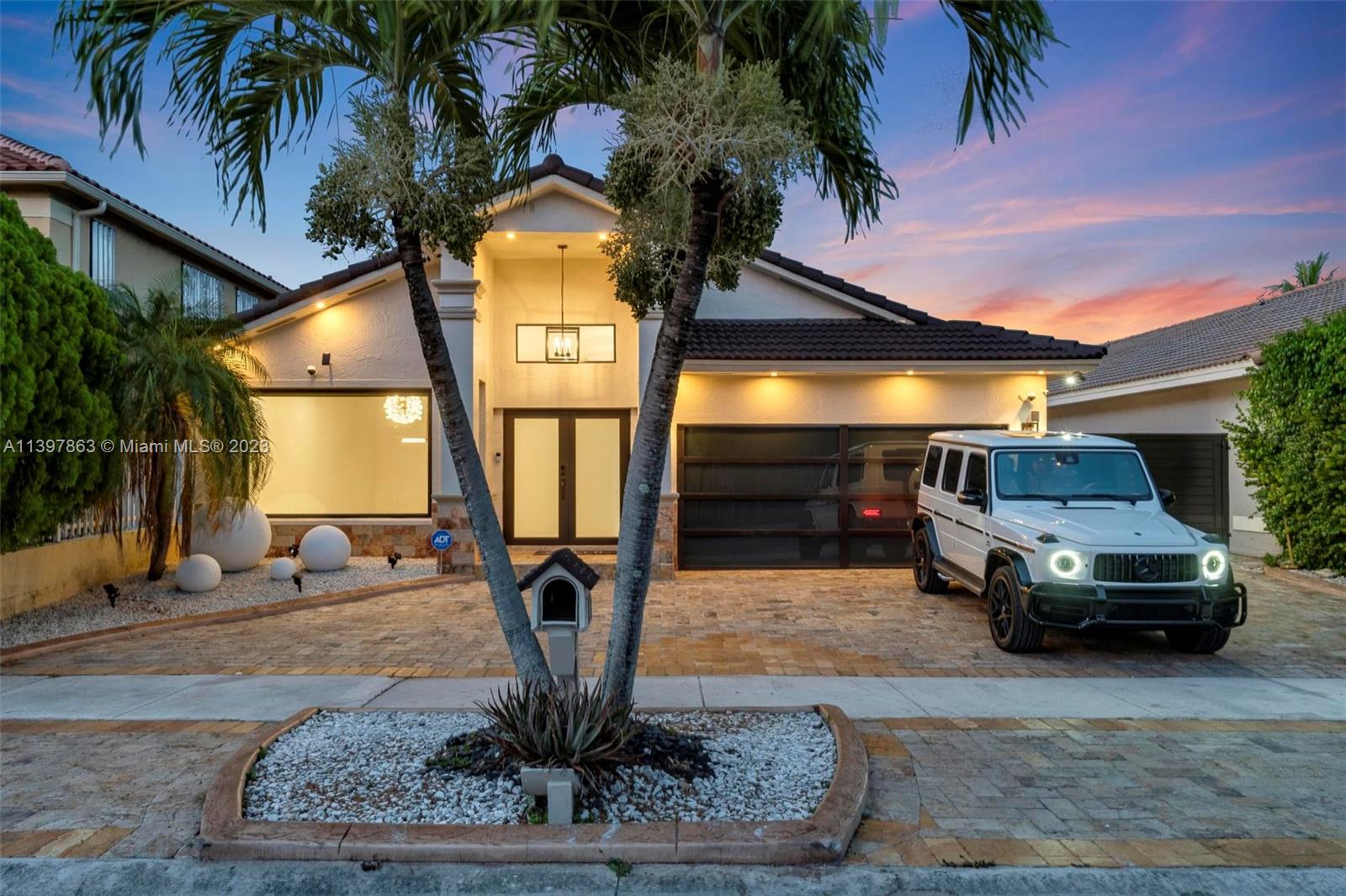 NO HOA, Welcome to this charming pool home with two master bedrooms. This stunner features 4 bedrooms/4 full baths (2 en-suite, 1 cabana) and an upgraded garage with private entrance ,2nd master bedroom perfect for multi-generational living. Also includes a beautiful kitchen with wood cabinets and high end stainless steel appliances, impact windows and doors ,travertine circular driveway, and large Side driveway for a small boat/jet ski, updated saltwater pool with LED lighting and heater with a fully equipped summer kitchen under a beautiful pergola. W/H without tank, new AC, beautiful chandeliers in the living room and dining room, rooms with beautiful wallpaper, security alarm systems. Partially furnished, central location close to shops, excellent schools, restaurants and expressway
