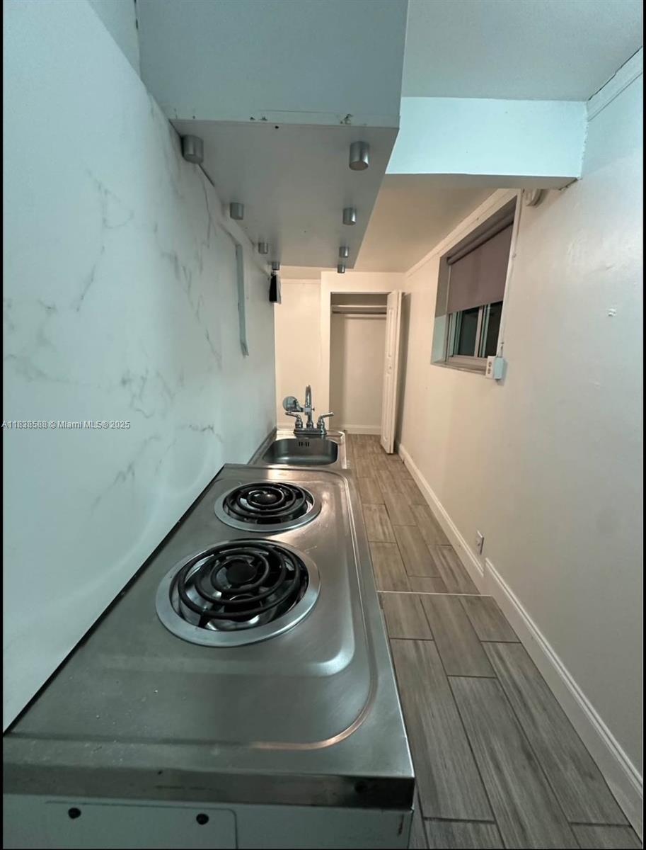 Home includes Electric, Wifi & Cable. Just minutes away from Palmetto or Turnpike. Efficiency has 1 parking, Kitchenette, Small Refrigerator Microwave, Outdoor Garden in a Family Oriented Neighborhood. No Washer/Dryer.