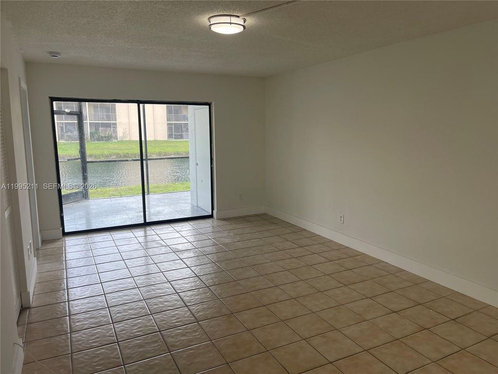 Photo of 3199 Foxcroft Rd #110, Miramar, FL 33025 (MLS # A11995211)