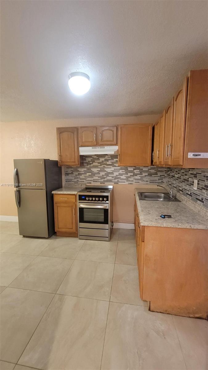Beautiful, attached, upgraded studio apartment with its own private, gated, entrance on west side of the property. This unit is light and bright and offers a convertible bedroom, separate bathroom with granite counter top, step-down shower, and walk-in closet. A separate, spacious, kitchen has been tastefully done with glass tile insets at back splash, granite counter tops, S/S refrigerator, electric range, and a comfortable dining area complete with pantry. Fully fenced and rear west corner offers an open shared patio for your relaxation. Great for an individual or 2-person family. All utilities included. Unit is centrally and conveniently located to bus routes, Oakland Park Blvd., SR#7, shopping, parks and more. Give me a call to schedule a tour and make this your home today.
