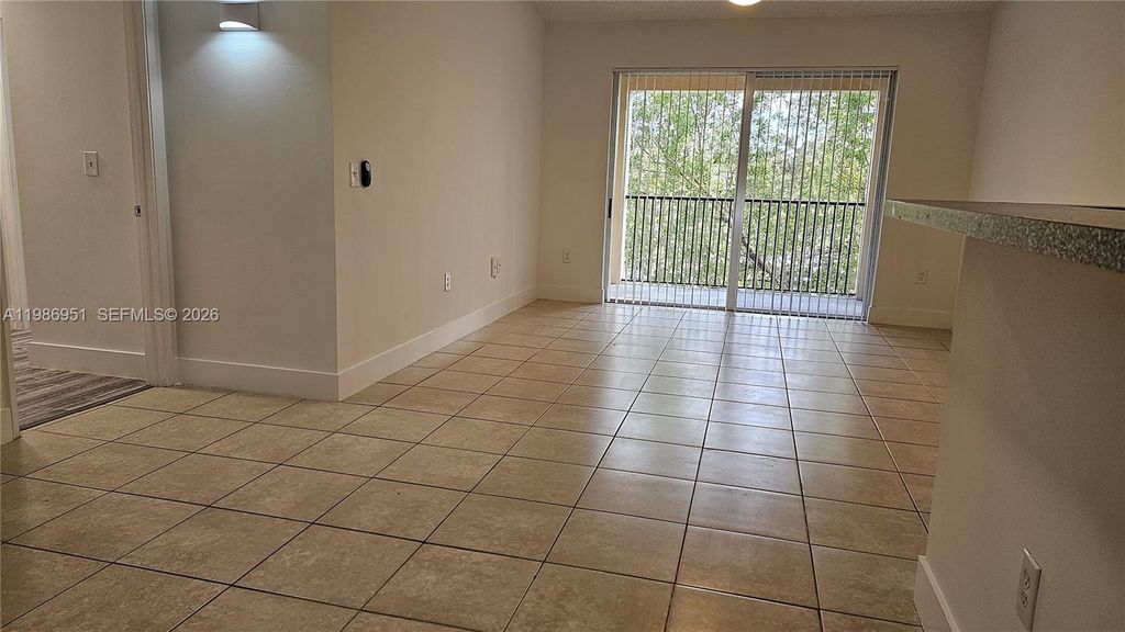 Photo of 8040 N Nob Hill Rd #303, Tamarac, FL 33321 (MLS # A11986951)
