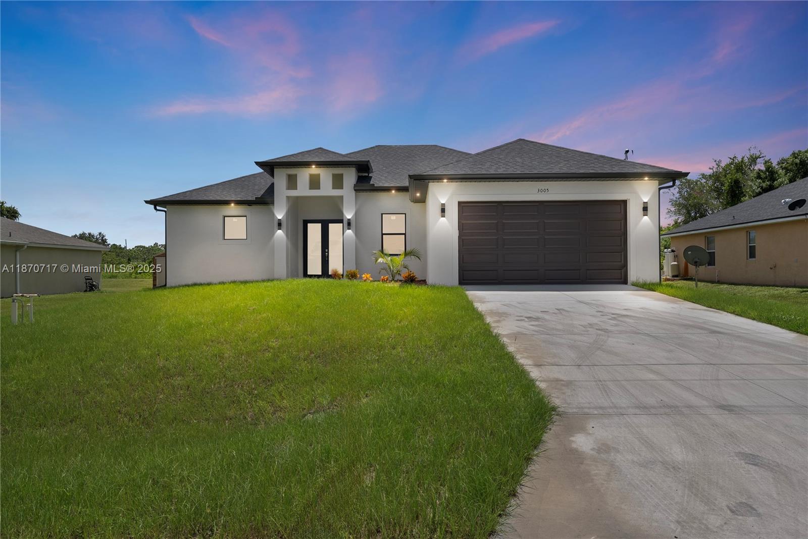 Brand new and completed in April 2025, this 3-bedroom + Den, 2.5-bath home in Lehigh Acres offers modern design and flexible living on a 0.25-acre lot with an oversized backyard and sprinkler system. The open floor plan features 10' ceilings and 11' coffered ceilings in the living and primary suites. The Den can serve as a 4th bedroom. The kitchen highlights quartz countertops, stainless steel appliances, and a large island for entertaining. The primary suite includes a walk-in shower, double vanity, and private water closet, with tile flooring throughout. Enjoy a covered lanai, exterior half bath, hurricane-rated windows and doors, pre-wired security, and a 2-car garage. Near Sunshine Blvd and SR 82, with easy access to shops and parks. Seller may contribute to buyer’s closing costs.