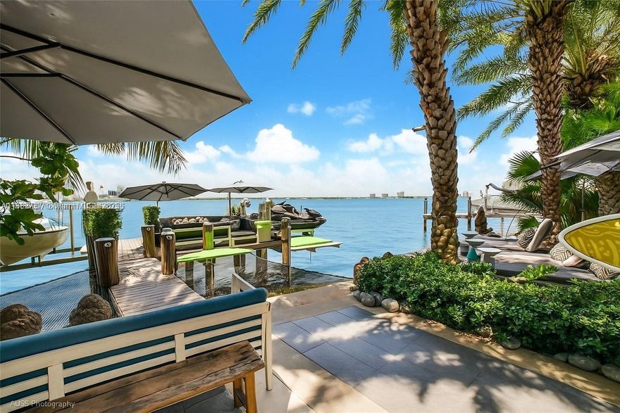 One-of-a-kind waterfront masterpiece! This unique home sits on a cul-de-sac on Normandy Shores exclusive gated community, w/ Normandy Shores Golf Club, Tennis, Basketball Courts, and Parks. Nestled on the Island's Terrace, shares w/only 6 residences breathtaking open bay views and sunsets. Built in 2015, this 3,442 SQ FT eccentric home features 4 bed/4 bath, open living and dining, state-of-the-art kitchen, and more. The home's Zen vibe begins as you step through a bamboo garden, 30 ft interior waterfall, and end at the open bay sanctuary. The backyard landscaping, shimmering pool, outdoor kitchen, and terraces make this home magic. Bath in the outdoor tub, watch movies at the two-story Tiki Hut, and enjoy the dock at sunset. Boat and Jet Ski lifts and davit. Plans for a two-car garage.