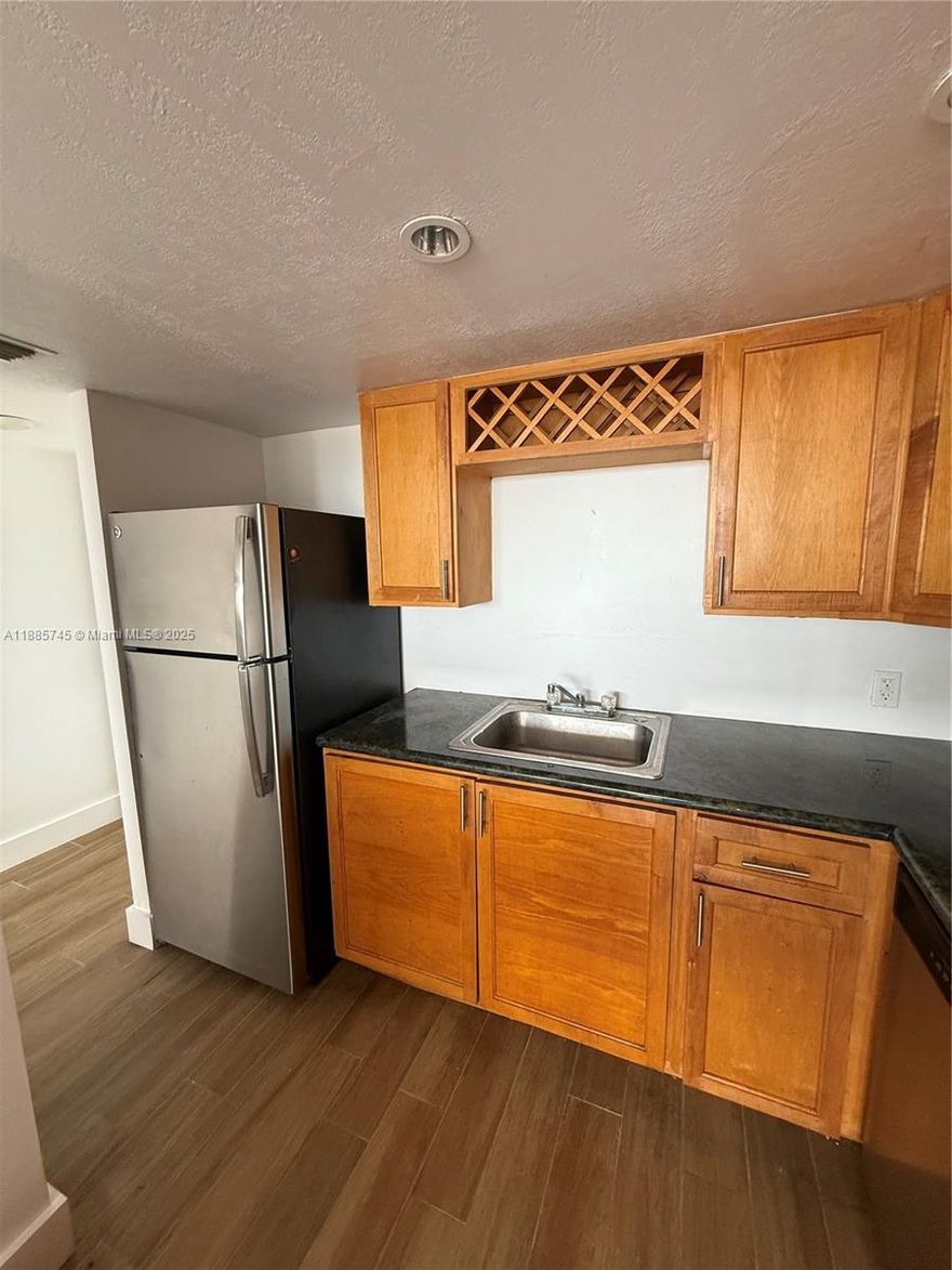 1 Bedroom, 1.5 Bath and balcony with a Northeast waterway view. Upon entering the unit you are met with a sunlit living area and tile flooring throughout. The kitchen features modern white cabinetry, refrigerator, dishwasher, convection oven and ceramic tile flooring. A communal laundry area Conveniently located within close proximity to Shopping, Restaurants, Grey Reynolds/Oleta River parks, Biscayne Blvd., Sunny Isles Beach and more. The building is currently undergoing remodeling and upgrades, which will further enhance its value. In addition, the hot water system is being replaced and is expected to be fully operational within approximately one month.