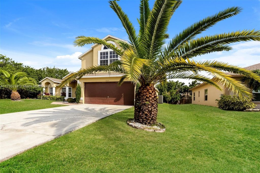 Photo of 1065 SW Haleyberry Ave, Port Saint Lucie, FL 34953 (MLS # A11735259)