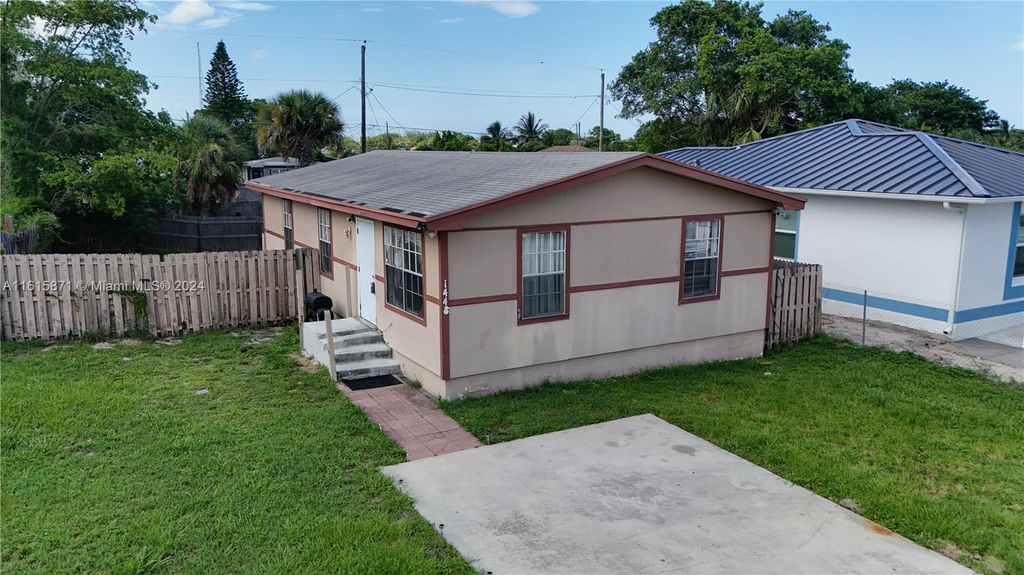 Photo of 1448 W 32nd St, Riviera Beach, FL 33404 (MLS # A11615871)