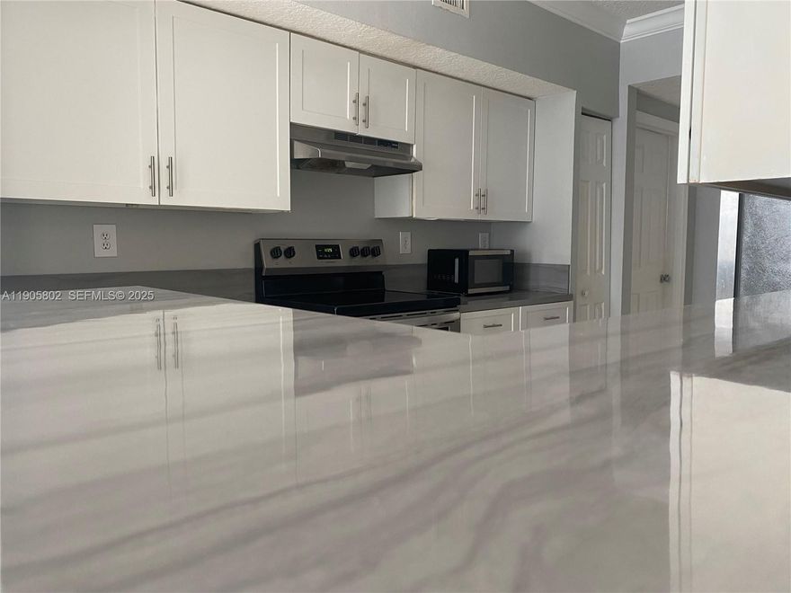 ONLY TWO MONTHS Move-in SPECIAL for Eligible applicants who meet credit and screening criteria. Beautifully renovated 2BD/2BA condo in the sought-after Marquesa community of Pembroke Pines. Features elegant ceramic floors, a modern kitchen with stainless steel appliances, and spacious bedrooms with walk-in closets. Enjoy the convenience of an in-unit washer and dryer, one assigned parking space, and guest parking. This gated community offers resort-style amenities, including a pool, gym, clubhouse, cinema, racquetball court, and playground. Prime location—steps from shops, dining, grocery stores, and the hospital. Fast association approval process of up to 10 days! No pets permitted.