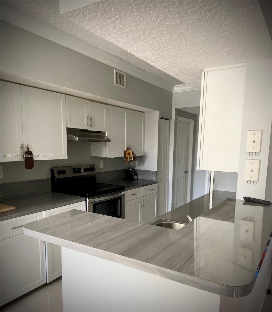 Beautifully renovated 2BD/2BA condo in the sought-after Marquesa community of Pembroke Pines. Features elegant ceramic floors, a modern kitchen with stainless steel appliances, and spacious bedrooms with walk-in closets. Enjoy the convenience of an in-unit washer and dryer, one assigned parking space, and guest parking. This gated community offers resort-style amenities, including a pool, gym, clubhouse, cinema, racquetball court, and playground. Prime location—steps from shops, dining, grocery stores, and the hospital. No pets permitted.