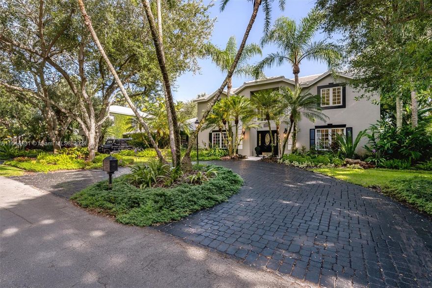 Discover Classic Miami in this stunning 4700+ SF traditional home, set on nearly an acre in serene Palmetto Bay. This exquisite property blends elegance with classic colonial finishes in a breathtaking setting. Enter through a double-height foyer into spacious, sophisticated rooms adorned with beautiful millwork, hand-painted ceilings, and crown molding. The home features 6 BRs, 6 Bths, + a private office & den. The chef’s kitchen, with Viking appliances and custom white cabinetry, is the heart of the home. French doors in the dining and family rooms open to a picturesque backyard with 22 magnificent oak trees. The newly built 1,100+/- sq. ft. poolside cabana is a private sanctuary with an additional bedroom and 2 baths. The backyard is a haven with a pool, spa, outdoor kitchen, and BBQ.