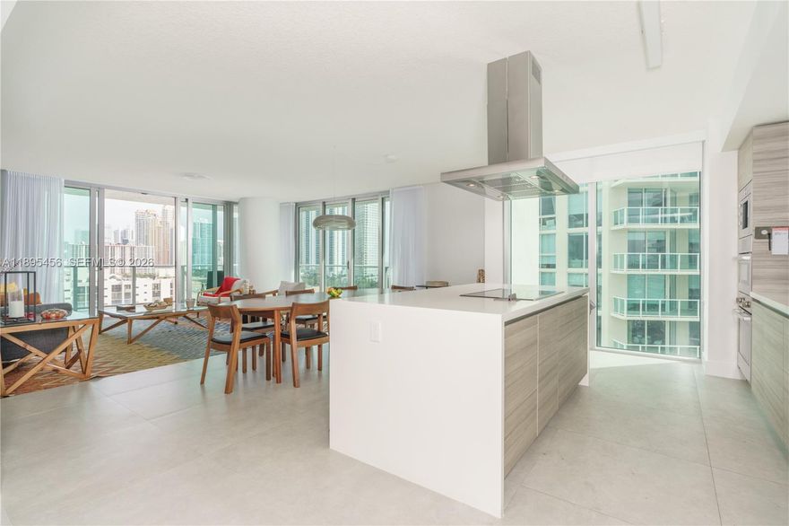 CORNER unit with OCEAN view and wrap-around balcony. True 3-bedroom suites (not a 2+Den) with 3.5 baths and 1,892 sq ft (176 m²) of open living. Modern kitchen with large island, Bosch and Sub-Zero appliances, and custom Italian cabinetry. Upgrades include 24×24 Italian tiles, spa-style primary bath with soaking tub, and dedicated laundry with side-by-side units. Enjoy resort amenities: infinity pool, jacuzzi, gym, cinema, game and kids rooms, plus 24/7 valet, security, and beach service. Easy to show—schedule your private tour today!