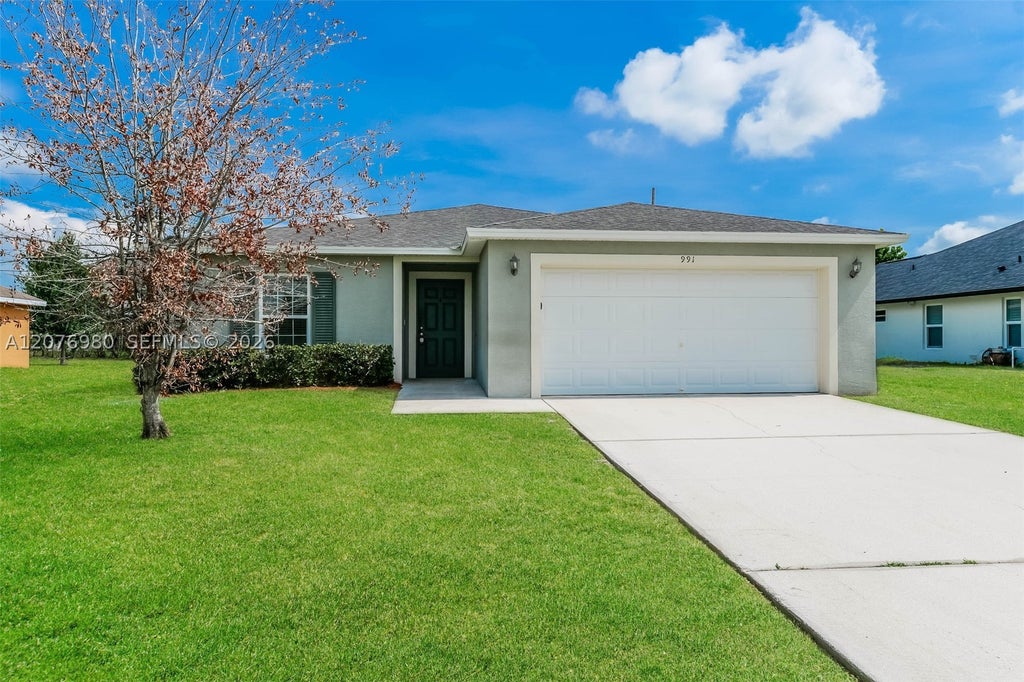 Photo of 991 SW Dubois Ave, Port St Lucie, FL 34953 (MLS # A12076980)