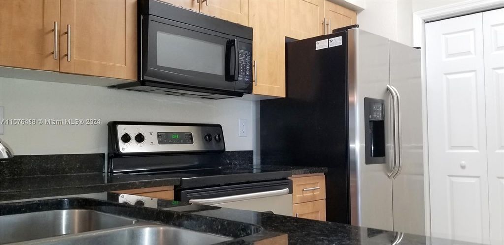 Photo of 6418 Emerald Dunes Dr #303, West Palm Beach, FL 33411 (MLS # A11576488)