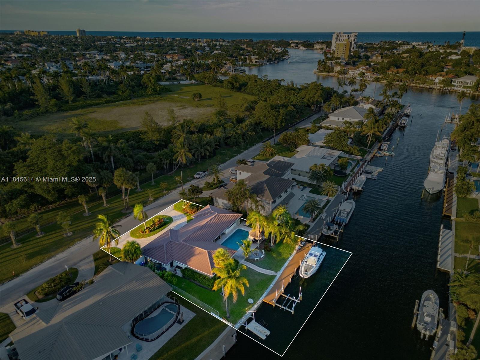 Experience waterfront living in this beautifully renovated 3-bed, 3-bath home in Hillsboro Harbor with 105 feet of waterfront and direct ocean access in front of the park. Enjoy a 13,000-lb boat lift, floating dock, and no fixed bridges. The home features a modern German kitchen with Bosch appliances, impact windows, updated bathrooms, and a new roof. The resort-style backyard includes a south-facing pool, sauna, and tiki hut. Located on a quiet cul-de-sac, the property offers a brick-paved circular driveway and garage with a new door. This move-in ready gem is ideal for boating enthusiasts and entertainers alike. Schedule a showing today!