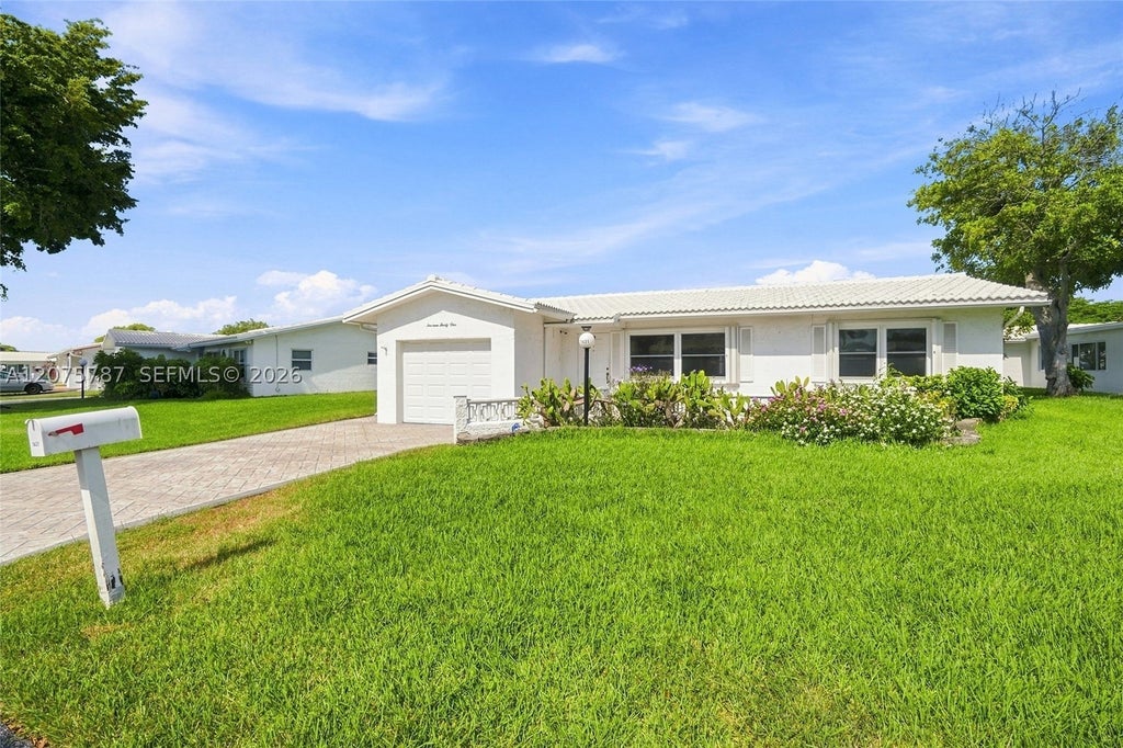 Photo of 1431 NW 85th Way, Plantation, FL 33322 (MLS # A12075787)