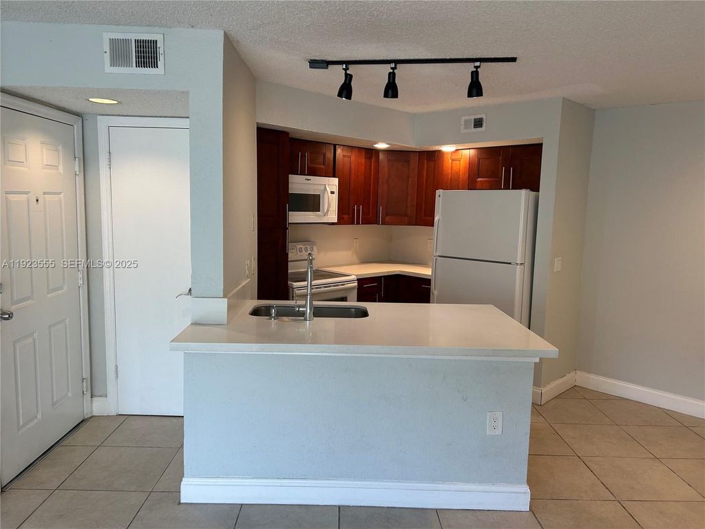 Photo of 12980 Vista Isles Dr #312, Sunrise, FL 33325 (MLS # A11923555)