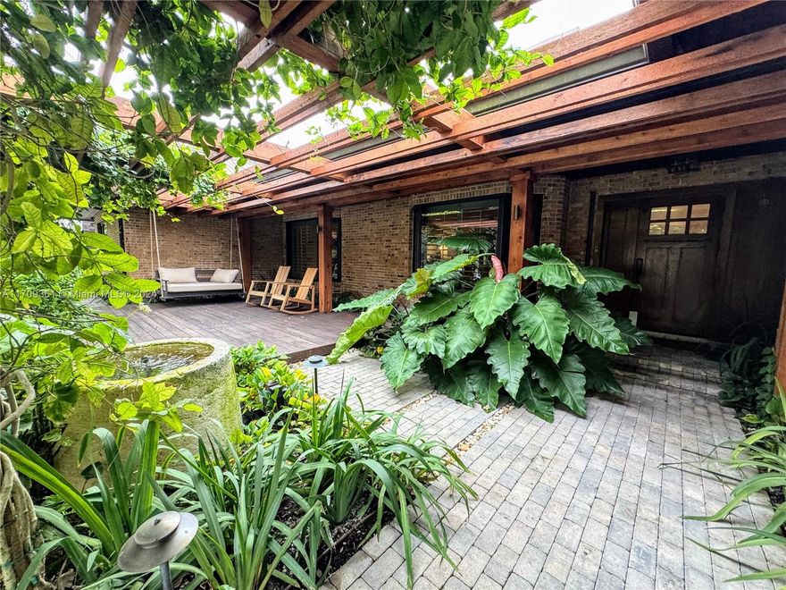 This fully remodeled 4-bed, 4-bath gem sits on 2.5 acres of SW Ranches’ prestigious oak-lined James B. Pirtle Ave, blending modern luxury with timeless charm. Features include a gourmet kitchen, oak floors, Chicago brick accents, custom Italian finishes, automated lighting, climate control, impact glass, and a state-of-the-art security system. Outdoor highlights: saltwater pool/spa, lush fields, towering oaks, a 3-stall barn with fans, tack room, wash bay, 5 paddocks, and a guest house above the stable. Located in an equestrian-friendly community with A+ schools. Easy to show—perfect for discerning buyers!