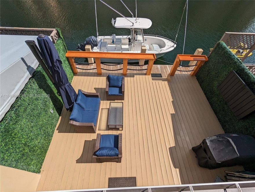 TURN-KEY WATERFRONT & DOCK IN GUARD-GATED EASTERN SHORES. This immaculate 2BR/2.5BA + Den/Office (or 3rd BR, has closet) 2-story townhome sits on a wide ocean-access canal with dock in your backyard. 100% move-in ready with a modern layout & high-end finishes. The 1st floor features polished travertine marble and an open kitchen with a butcher block island and real wood cabinetry. Upstairs, enjoy wood LVP flooring and two luxurious suites with HUGE walk-in rain showers, floating vanities, and Delta Vero fixtures. The Master suite boasts a 20ft waterfront balcony and a massive walk-in closet with built-in organizers.

OUTDOOR OASIS: Private wood deck, bar counter at dock's edge, and a weatherproof TV enclosure. 20ft dock offers unlimited ocean access with no fixed bridges and 15 min boat ride to the sandbar or Haulover Inlet.

ALL SYSTEMS UP TO DATE: Hurricane impact windows/doors, 100% LED lighting, modernized infrastructure incl electrical, AC ducts, plumbing (including underground), new roof in 2025 and seawall reinforcement in progress.  ALL assessments are PAID IN FULL. 

HOA covers building insurance, pool, game room, & landscaping. No HOA approval required. Eastern Shores features a 24/7 manned guard gate PLUS a NMB Police officer exclusively patrolling this neighborhood 24/7.  Short 10 minute walk to Intracoastal Mall dining/shops and the beach is just over the bridge. Needs nothing. Move in tomorrow for the ultimate worry-free South Florida waterfront lifestyle!