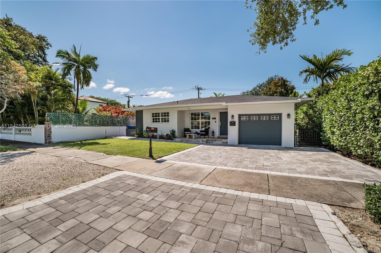 Located in the sought-after Shorecrest community in the City of Miami, this centrally located 2-bedroom, 2-bath home features wood floors throughout, impact windows and doors, a new roof with solar panels, and a paver driveway. The fully fenced backyard includes a paver floor with outdoor lighting—ideal for relaxing or entertaining. The layout offers functional living space with a comfortable flow. A meticulously maintained property in a prime neighborhood, just minutes away from Midtown, the Design District, Miami Beach, Bal Harbour, as well as marinas, restaurants, shops, and major roadways.