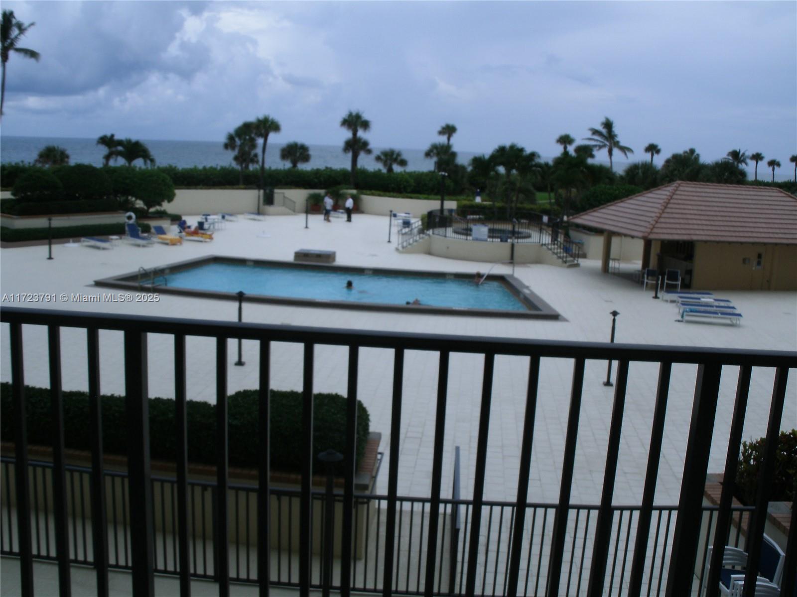 Spectacular ocean views from this updated 2 bedroom, 2 bath furnished condo. King bed in master bedroom & 2 twin beds in 2nd bedroom. Tile throughout, and washer/dryer in the unit. Community is on the beach with close proximity to golfing, restaurants, shopping, theaters. PBIA, Kravitz & City Place are approximately a 30 minute drive. Private access to the beach & Jupiter Beach Resort for restaurant & spa. There is a Tennis Club on the grounds with a pool. Since construction of the pool/patio area is ongoing, the tennis pool is available for your use. Due to the construction, the rent has been greatly reduced.