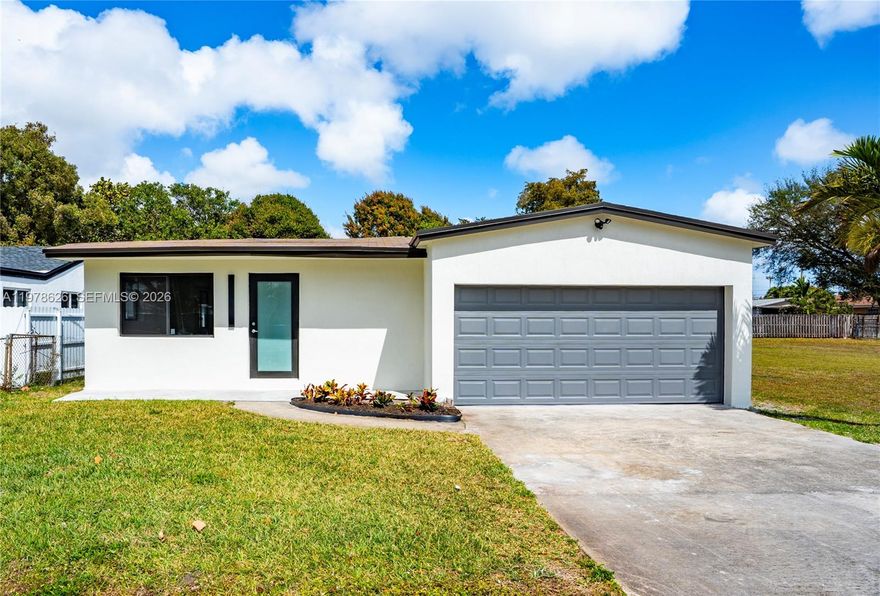 Beautiful modern 4BD/2BA residence offering nearly 1,900 sq ft of thoughtfully designed living space. The home features a bright open layout with stylish finishes and spacious living and dining areas ideal for entertaining. The expansive primary suite is privately situated on a separate wing of the home, providing comfort and privacy. Situated on a generous lot with a large backyard and a 2-car garage. Conveniently located near major highways, shopping, dining, parks, and just minutes from Hollywood, Fort Lauderdale, and area beaches. Move-in ready and easy to show.
