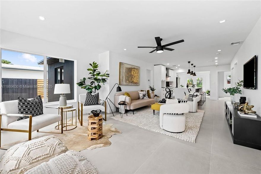 Reimagined Modern Living in East Fort Lauderdale. Designed with today’s lifestyle in mind, this 4BD/2BA home was thoughtfully rebuilt from the studs up in 2022. The open split floor plan flows across large-format tile into a chef-inspired kitchen with sleek cabinetry, gas stove, and quartz waterfall island. The luxe primary suite features dual showers and a floating vanity, while impact windows, new roof, double French doors, and modern finishes elevate the home’s style. Enjoy a landscaped yard with room for a pool, boat/RV parking, and covered patio for seamless indoor-outdoor living. Walk to Whole Foods, Trader Joe’s, Pura Vida, schools, and shops—just minutes to Las Olas, Victoria Park, beach, and waterfront park with community boat ramp. Exterior photos coming soon.