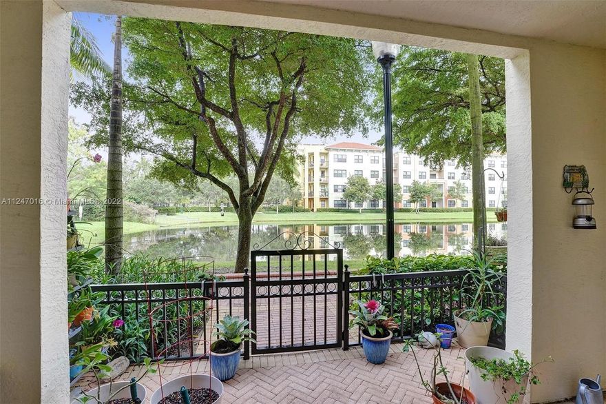 WATERFRONT 2BD/2.5BA+DEN ARTESIA CONDO IS A PERFECT SANCTUARY OF SERENITY. Spanning 2 floors, this updated "Botanica" corner unit shows like a model & is sited to optimize sparkling lake panoramas. The large patio offers a connection to the lush landscape & beyond. The stylish kitchen boasts granite tops, gas range & upgraded SS appliances. The primary suite is the home's pièce de resistance w/a private balcony, walk-in closet & spa-like bath. Tile floors in social areas; brilliant  hardwood (Egn.) upstairs. IMPACT WDWS/DOORS, plantation shutters, new washer/dryer, LED lights, upfront parking (2 cars) & bonus storage room! Enjoy superb amenities: tranquil pools, sports courts & fitness center! Steps from Sawgrass Mills & FLA Arena! CONDO FEE INCL: WATER, GAS, CABLE, INS, MAINT & MORE!