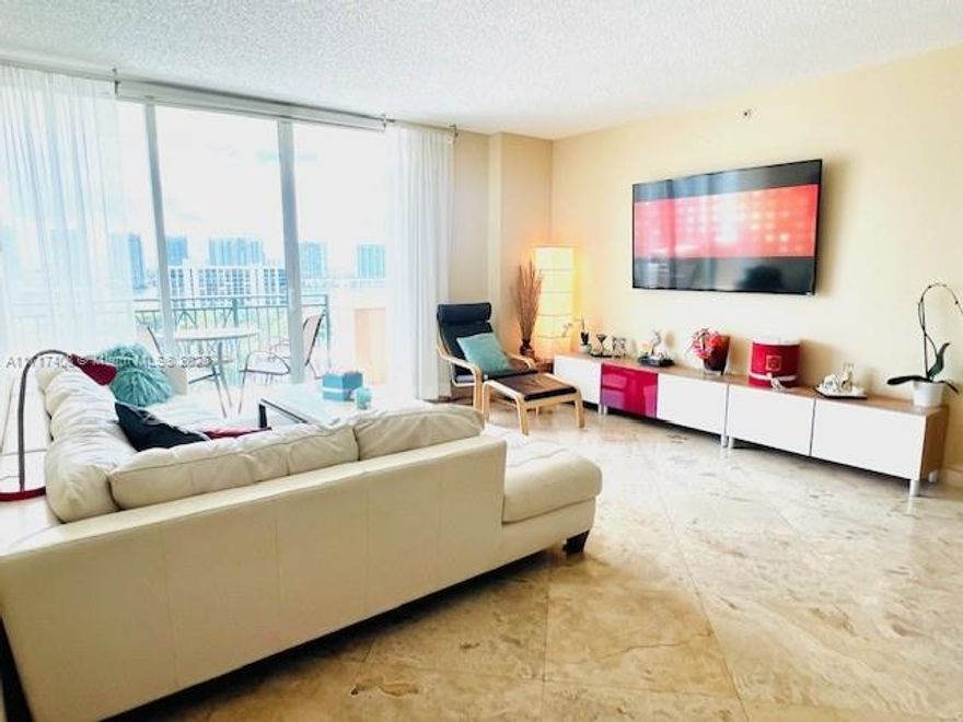 LOCATION! VIEW! LUXURY! PERFECTLY PRICED! Nestled in the heart of Sunny Isles this stunning fully furnished and professionally decorated 2 bed 2 bath home boasts glass sliding doors in every room, leading to an oversized balcony with breathtaking views of the canal and sunset. The open modern floor plan features a sleek kitchen and a master suite with a spacious walk in closet. Travertine floors throughout the unit. Washed and Dryer in the Unit! Ocean access point just across the street and top-notch amenities: 24-hour doorman and Valet, a heated pool and Jacuzzi, covered parking and bike storage, fitness center. A 24-hours Walgreens and numerous restaurants are right downstairs. Supermarket and middle school are within walking distance. Storage unit !Cable and Internet are included
