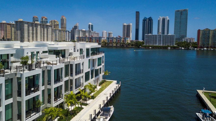 Welcome Home to Peace and Serenity. Townhouse 6 is located on the Inter-Coastal Waterfront of the 2024 Built, Koya Bay Townhouse Community within the gated Eastern Shores neighborhood. Be the first to live in a home that is bathed in natural light and spread across 4 stories of living space. The 3500 square feet comprises of 4 Bedrooms 4.1 Bathrooms. The floor-to-ceiling impact glass fully stacking doors effortlessly brings the outside in creating a seamless flow throughout each story. The owner spared no expense, the customized wall paneled Kitchen houses top of the line Wolf and SubZero Appliances and Wine Aficionado's are in for an incredible surprise! Lastly the property is pre-wired with a Smart Home Electronics and Security System easily accessed by a touch pad or app on your phone.