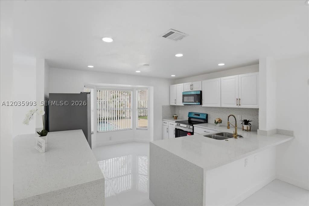 Photo of 13209 NW 12th Ct, Sunrise, FL 33323 (MLS # A12035993)
