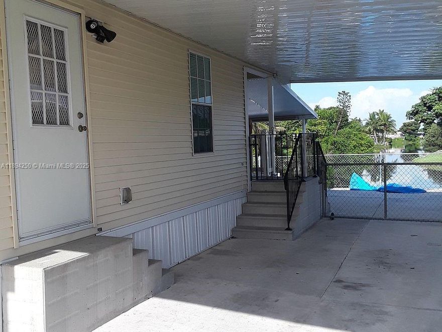 An excellent opportunity for residence or investment. This 2007 mobile home  is currently rented out and features 5 bedrooms and 3 bathrooms. A 2/1 unit is rented for $1,950  another 2/1 for $2,000 and a 1/1 for $700.Two of the unit has central A/C and one of them W/D inside the unit. Sale does not include land. The community offers a pool, basketball and tennis courts, and a children's play area. It's centrally located, with easy access to supermarkets, restaurants, highways, and more. The Property is located directly in front of a lake, offering serene water views and dock access - perfect for relaxing or fishing .