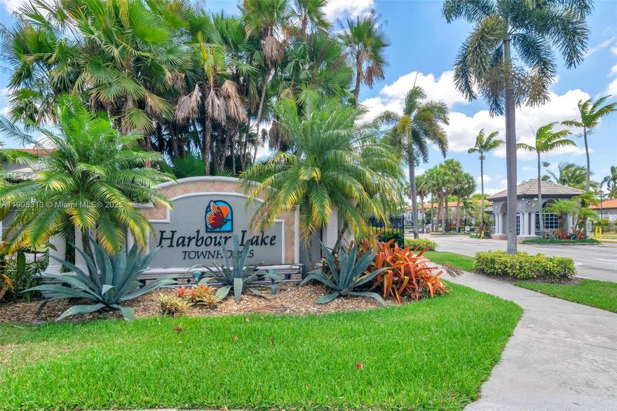 Welcome to this beautifully maintained 2-bedroom, 2.5-bath townhouse with a 1-car garage in the sought-after gated community of Harbour Lakes. This home features a stunning custom-designed kitchen with newer stainless steel appliances, elegant quartz countertops and a wine cooler. Enjoy the comfort of full hurricane-impact windows and door, a full-size washer and dryer, and laminate wood floors throughout the second level. Upstairs you’ll also find a cozy loft, perfect for a home office, reading nook, or play area. The spacious patio offers garden views, ideal for relaxing or entertaining. Additional highlights include a 2-car driveway plus guest parking. Centrally located near major roads, excellent shopping, dining, and access to Monarch Lakes Park. Simply beautiful and move in ready!