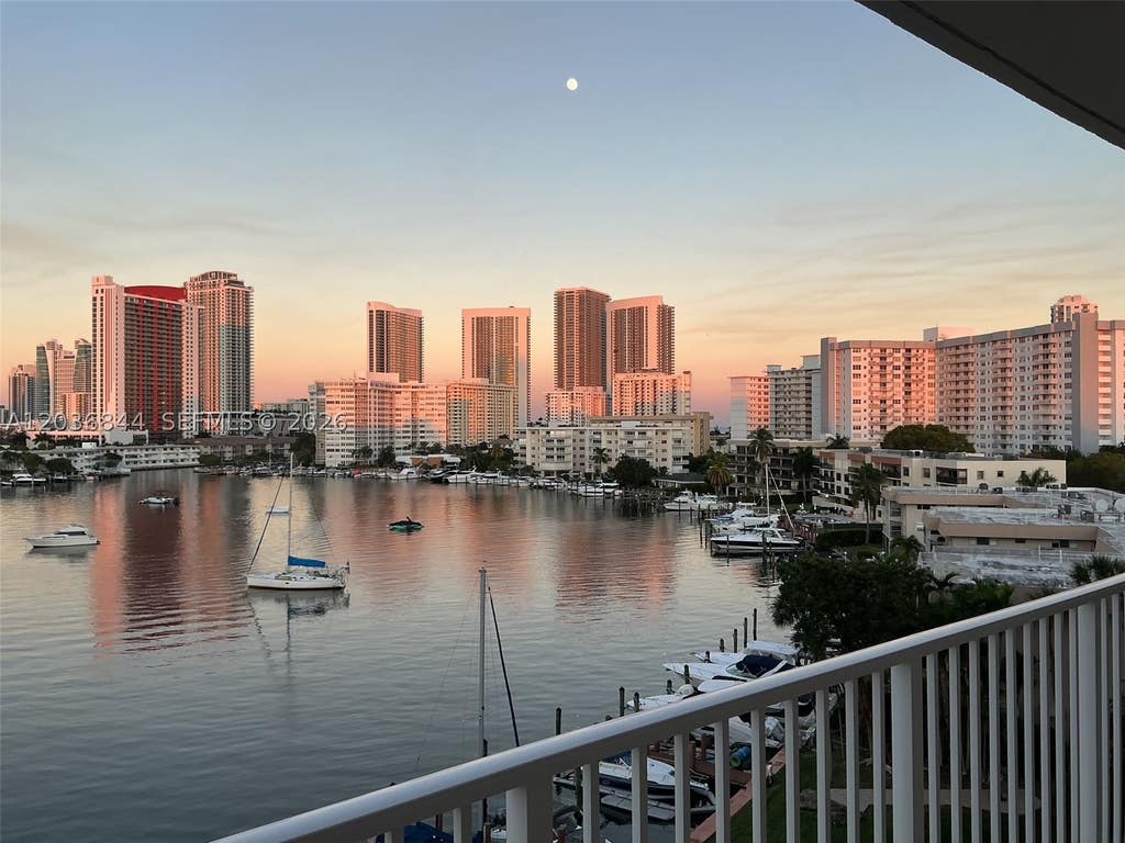 Photo of 400 Golden Isles Dr #55, Hallandale Beach, FL 33009 (MLS # A12036844)