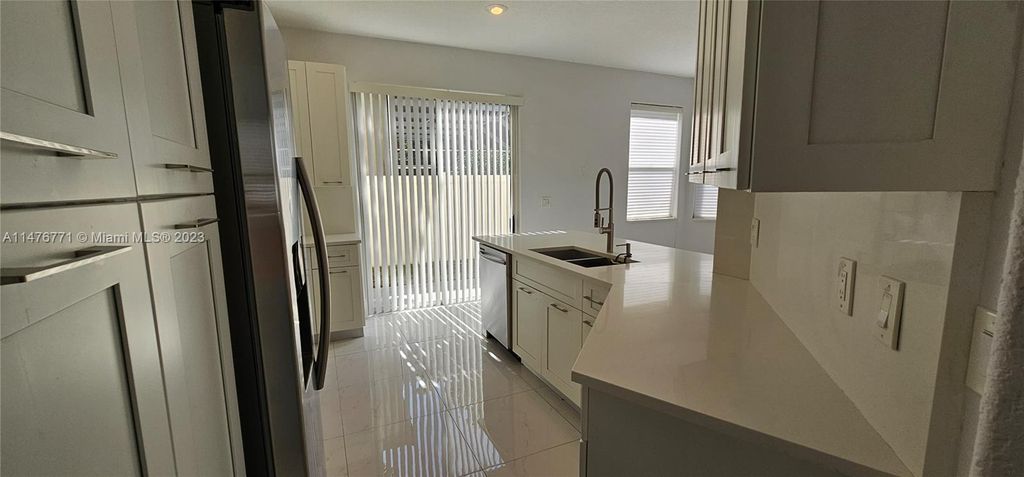 Photo of 6201 NW 58th Way, Parkland, FL 33067 (MLS # A11476771)