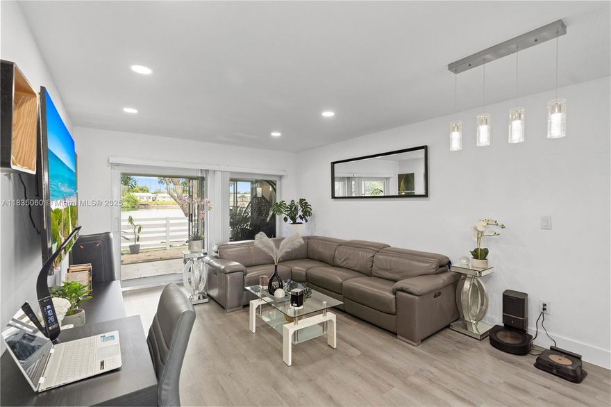 Looking for the perfect blend of comfort, style and affordability? Look no further! This beautifully renovated 2 bedroom 1 bathroom waterfront villa is truly a hidden gem! This home features newly installed hurricane impact windows and doors (2024), a newly renovated kitchen equipped with stainless steel appliances, quartz countertops and shaker cabinets, newly installed vinyl wood flooring, fresh paint, newer water heater and ac (2017). The backyard is a tropical oasis complete with a breath taking lakeview as well as mango trees providing prime relaxation and perfect for entertaining. This home is located just steps away from the newly renovated Caporella Park. Schedule your showing today!