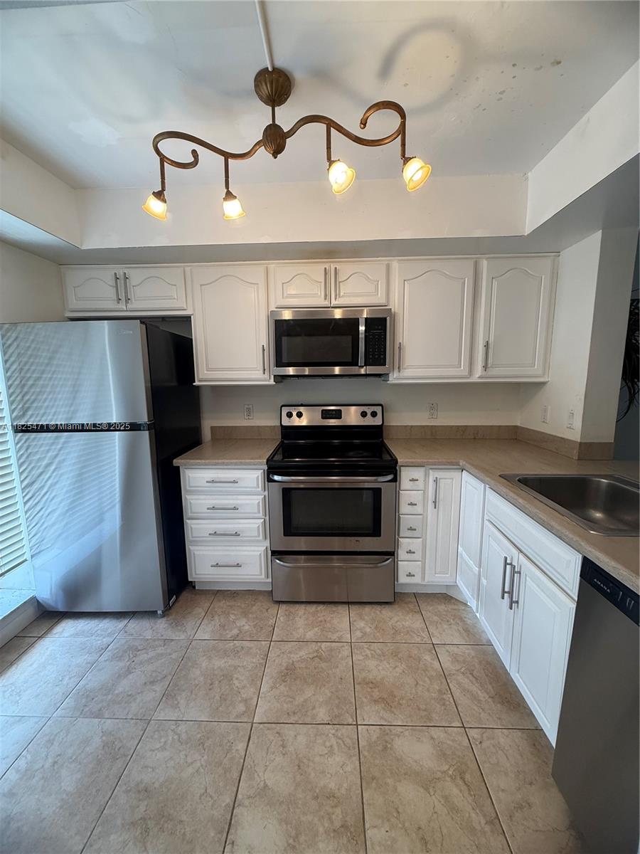 Welcome to this move-in-ready 1st floor 2-bed, 2-bath located in the highly desirable Resort-Style Living community of Meadowridge. This bright and spacious home features tile floors, updated kitchen and bathrooms, stainless steel appliances, in unit washer and dryer, storage room and hurricane shutters. Step outside to your private balcony facing the pool and clubhouse, or enjoy the impressive community amenities, including a heated swimming pool, jacuzzi, gas grill, gym, clubhouse with kitchen, library, night guard gated security, pet friendly, passed 40 years inspection, NO assessments, fully funded reserves. Located near the beach, shopping, dining, parks, and major highways, this condo offers the perfect balance of comfort, style, and convenience. Don't miss this oportunity.