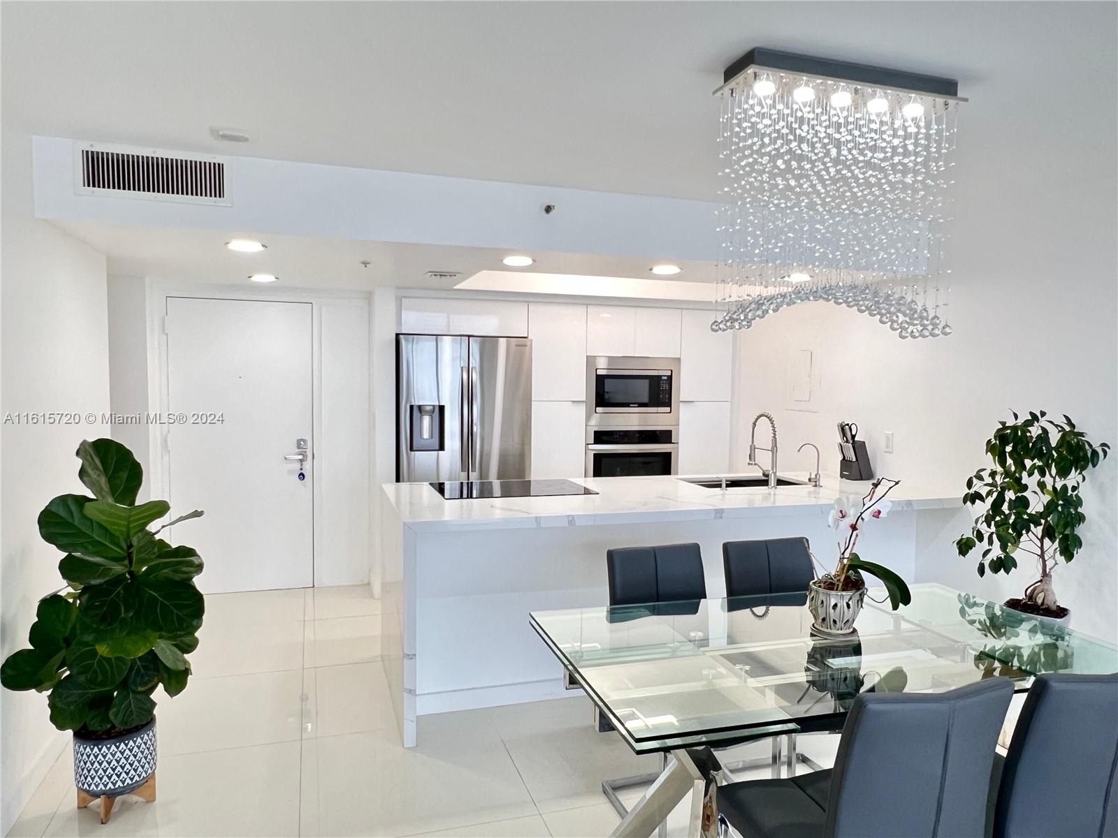 Exquisitely remodeled 2-bedroom, 2-bathroom condo offering unparalleled panoramic bay views. Unit features a spacious split floor plan, perfectly designed to maximize both privacy and functionality.
Modern open kitchen with sleek Italian gloss cabinetry, granite countertops, and brand-new stainless steel appliances. Large balcony, accessible from every room, creating an ideal indoor-outdoor living space.
Floor-to-ceiling sliding glass doors, walk-in closets. Two dedicated parking spaces and an in-unit washer and dryer.