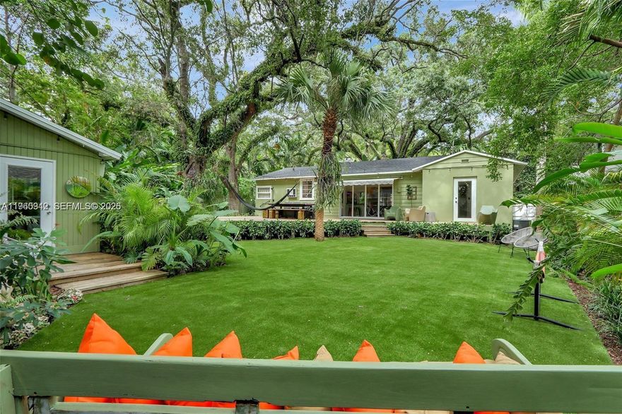 Located on what is widely considered the most beautiful street in Spring Garden, this exceptional property offers timeless charm, tropical serenity, and incredible flexibility. This oversized lot is surrounded by mature trees, lush landscaping, and picturesque architecture. The main residence features 3 bedrooms and 2 bathrooms, filled with character and natural light. Original details blend seamlessly with comfortable living spaces, creating a warm and inviting atmosphere. Large windows frame garden views and enhance the home’s airy, tropical feel.

Tucked privately on the property, the separate guest house includes a full bathroom — ideal for visitors, a home office, rental income, or creative studio space. The expansive grounds are a true highlight, offering a lush garden oasis with endless possibilities: expand, add a pool, or simply enjoy the peaceful outdoor setting. The tropical landscaping provides privacy and a tranquil retreat just minutes from Downtown Miami, Brickell, and the Health District.