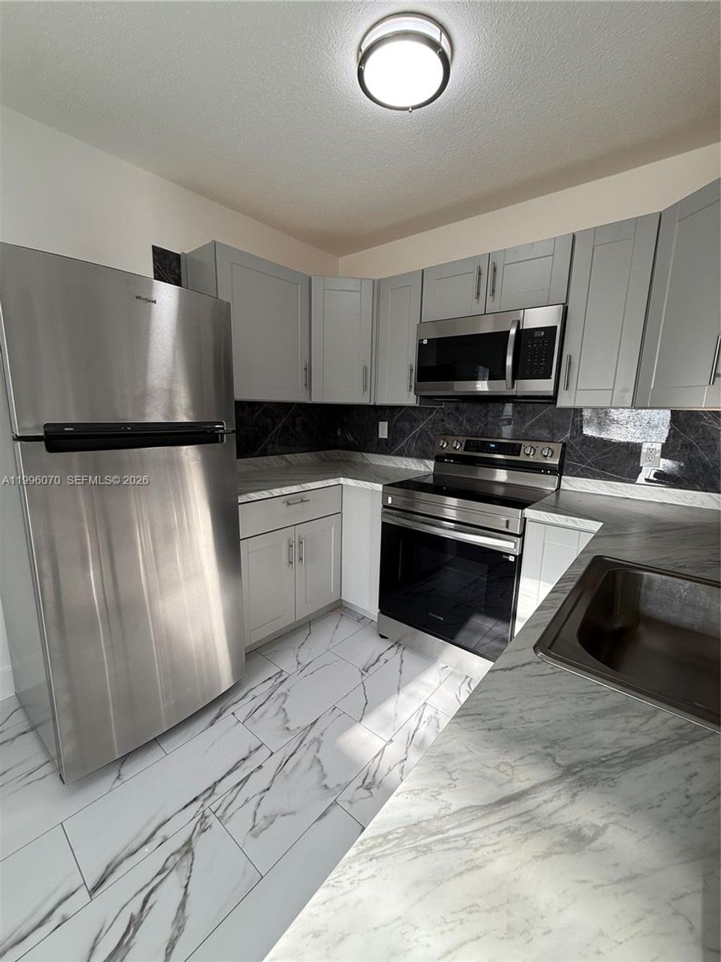 Photo of 6071 SW 33rd St #4, Miramar, FL 33023 (MLS # A11996070)