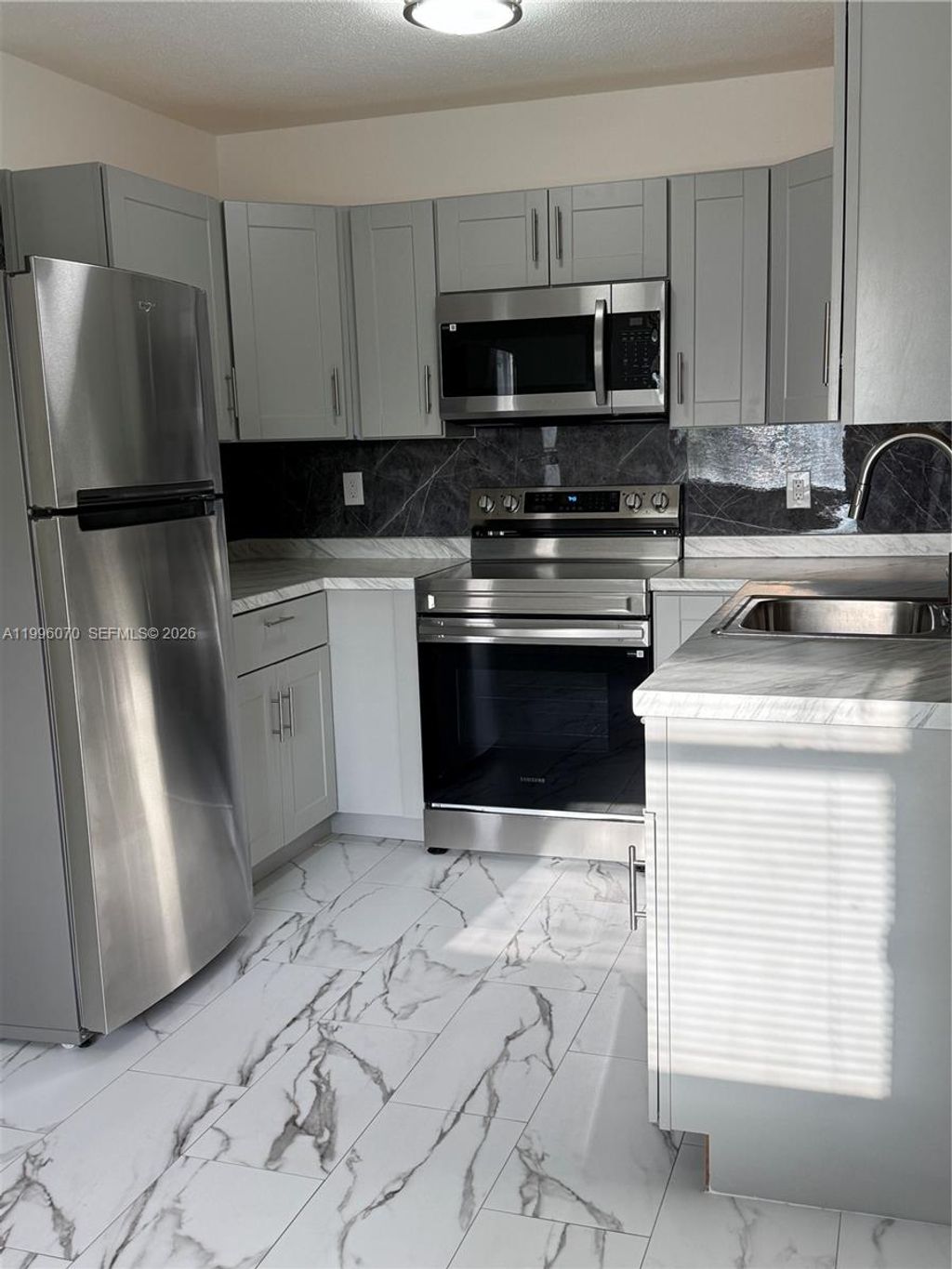 Photo of 6071 SW 33rd St #4, Miramar, FL 33023 (MLS # A11996070)