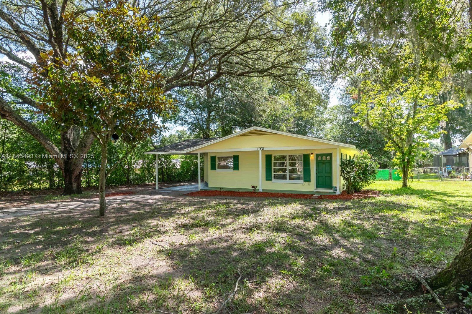 Tucked into the quiet neighborhood of Silver Springs Forest, this Ocala ranch offers more than just a place to live– it’s a place to grow into! Out back, a fully fenced yard stretches across a generous 0.32-acre lot, perfect for weekend barbecues, future gardens, or simply relaxing under the shade of mature trees. A large carport adds extra flexibility and comes complete with an outdoor utility area that includes the washer and dryer. With no HOA and a location just minutes from downtown Ocala’s top-rated dining and shopping options, nearby state parks, schools, and major roadways, this property blends space, location, and lifestyle with ease. Whether you’re starting out or settling down, this home is ready to be the backdrop for your next chapter!