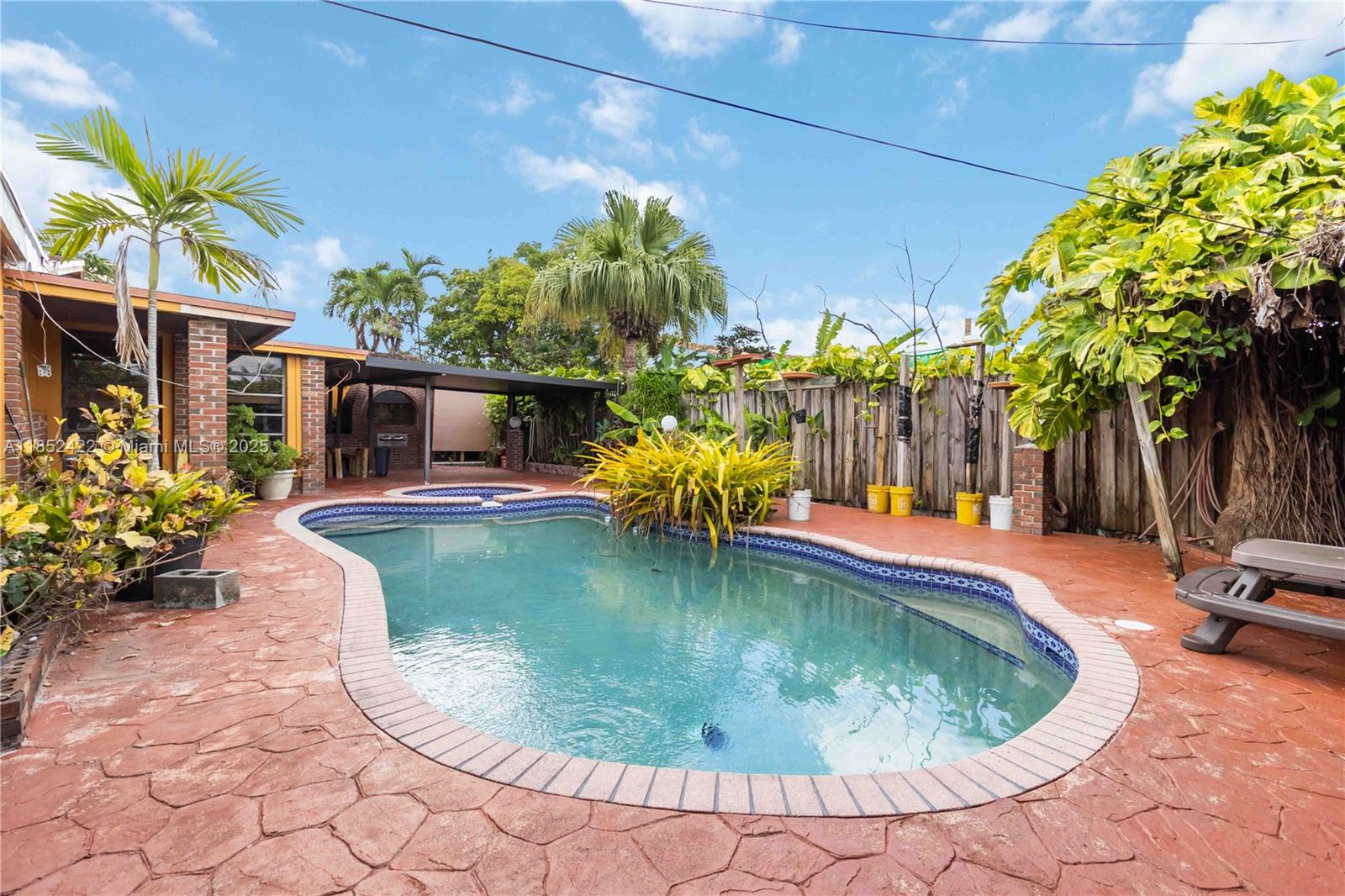 Welcome to 10255 SW 46 St, Miami, FL 33165, a multi-generational retreat where charm and functionality meet across 3,100+ sq ft of living space on a 10,000 sq ft lot. This home offers four bedrooms, a dedicated office, and a seperate suite ideal for guests. A total of 6 spaces are ready for versatility. The split floor plan provides privacy and flexibility, enhanced by Italian marble flooring, granite countertops, double sinks, dual gas stoves, and an electric cooktop. Enjoy two wood-burning fireplaces, a wrap-around patio with a brick oven and gas stove, a private pool with travertine decking, and off-street parking. A new roof adds peace of mind. Centrally located near major expressways, parks, colleges, and Miami International Airport, everything you need is just minutes away.