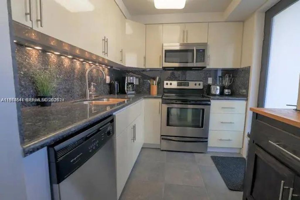 Photo of 301 Golden Isles Dr #109, Hallandale Beach, FL 33009 (MLS # A11974541)