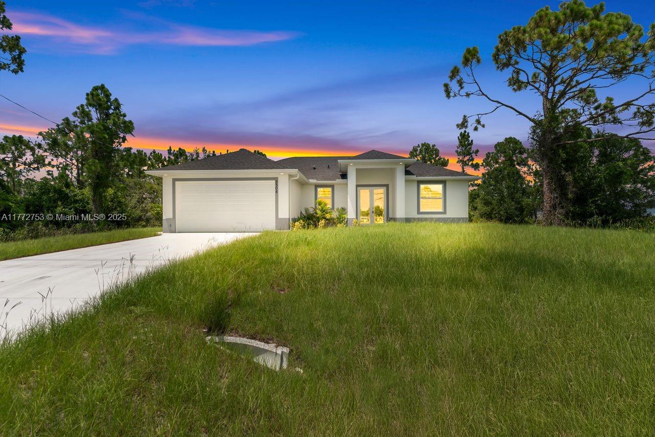 Welcome to an exceptional new construction residence in the heart of Lehigh Acres, where contemporary luxury meets thoughtful design. This impeccably crafted home presents an enticing blend of sophistication and practical living spaces, offering three bedrooms and two well-appointed bathrooms. Step through the elegant double-door entry into a home that exemplifies modern Florida living. The great room design creates an impressive sense of openness, seamlessly connecting living spaces and establishing an ideal environment for both entertaining and daily life. The heart of this home is its beautifully conceived kitchen, featuring a traditional eat-in design enhanced by a generous island that doubles as a casual dining space. FOR THE REST OF DESCRIPTION REFER TP SUPPLEMENTAL REMARKS!!!!