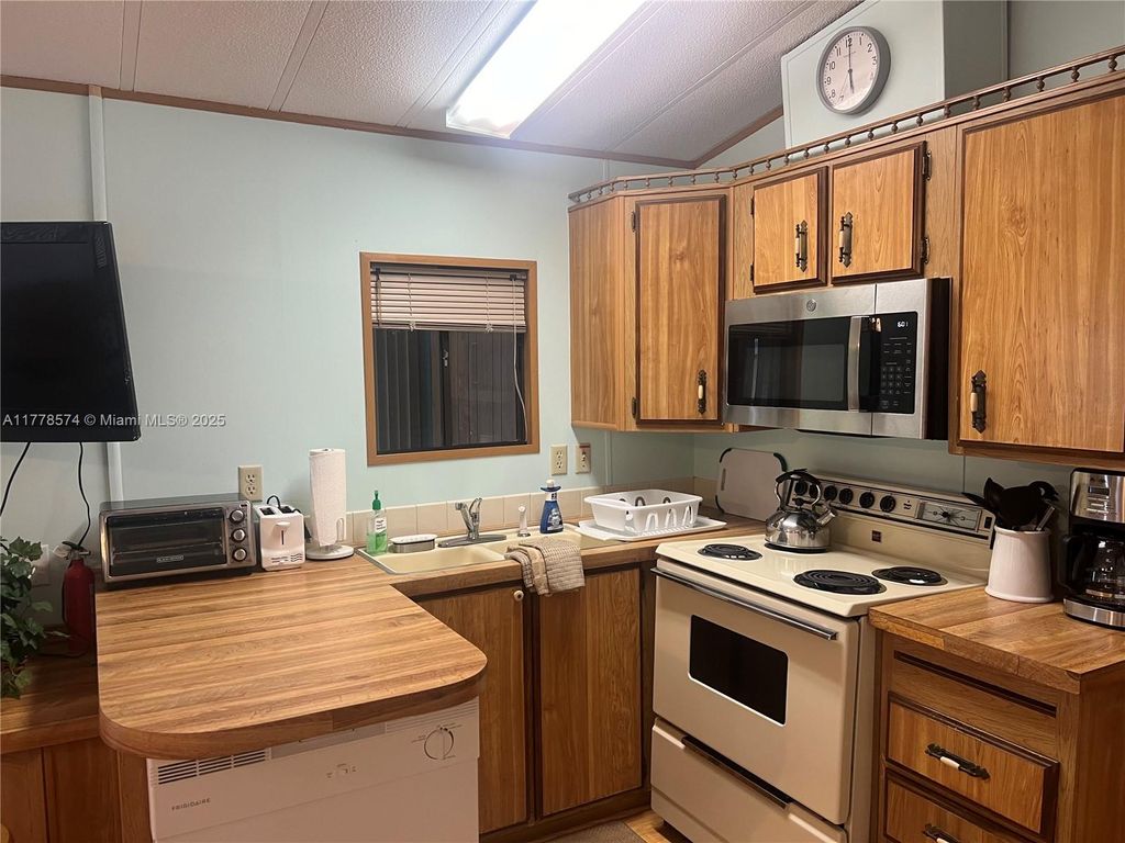 Photo of 2064 Nettles Blvd, Jensen Beach, FL 34957 (MLS # A11778574)