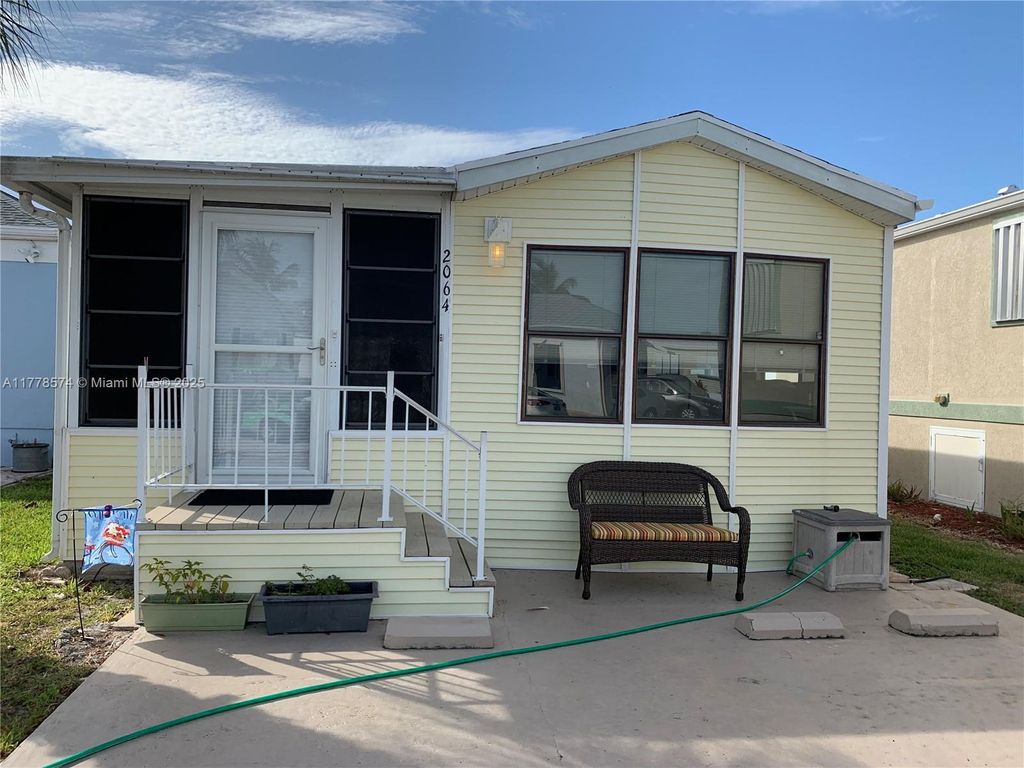 Photo of 2064 Nettles Blvd, Jensen Beach, FL 34957 (MLS # A11778574)