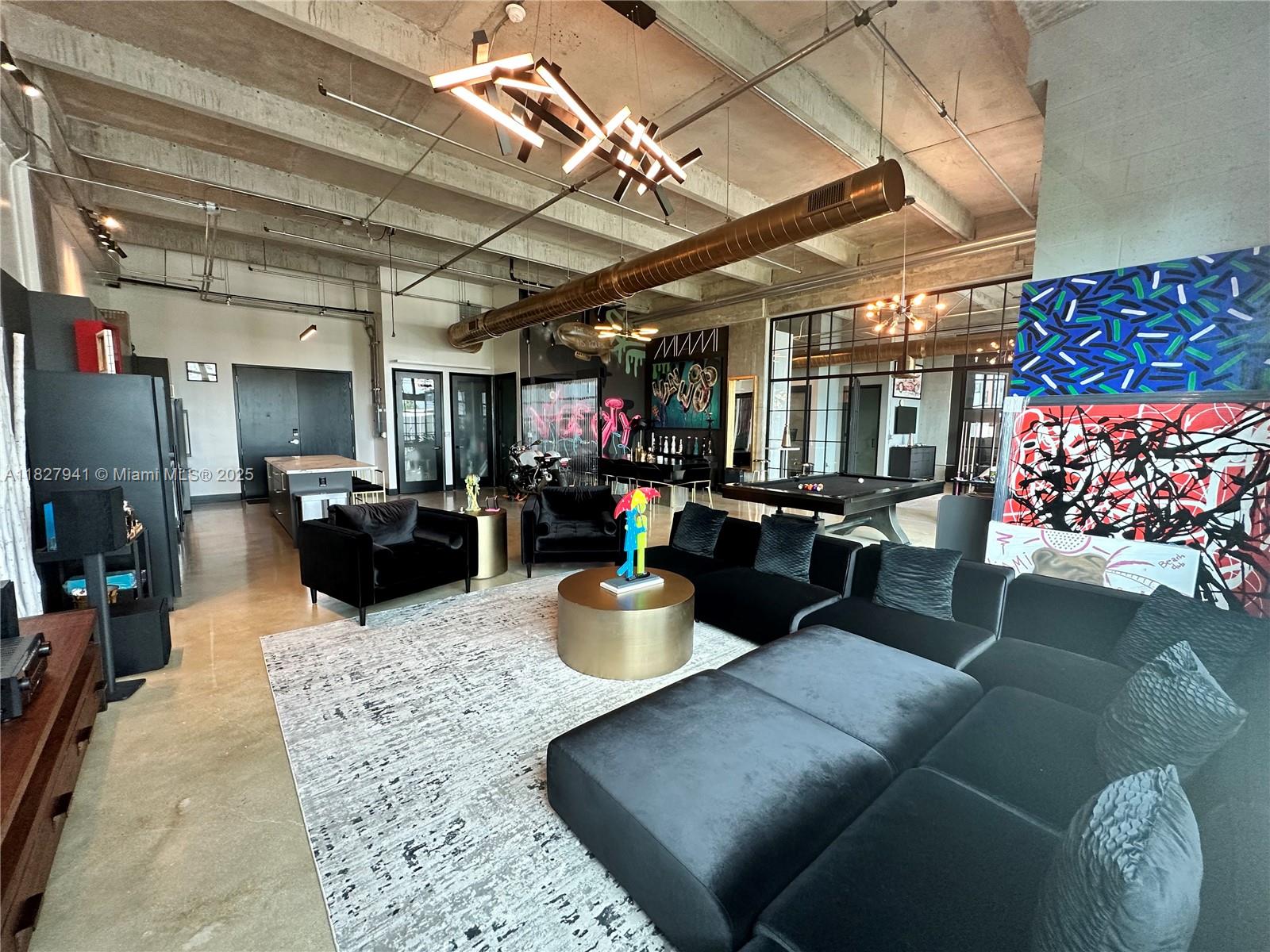 Parc Lofts 404 & 405 Combined total sq ft 1946 sq ft. plus 2 balconies. NY Style Industrial Loft with 15' ceiling heights. Completely renovated in 2022, polished concrete floors, modern kitchen with all new Bosch appliances plus 500 bottle wine cooler, large kitchen island with tons of storage. 2 full bathrooms with glass enclosures, large master bedroom with large wall closet and room for office or sitting area. The unit comes fully furnished as seen in photos, minus artwork. Unit also comes with 2 parking spaces. Parc Lofts is centrally located in the Arts and Entertainment District minutes from Wynwood, South Beach and Brickell. Call Listing agent for showing instructions.