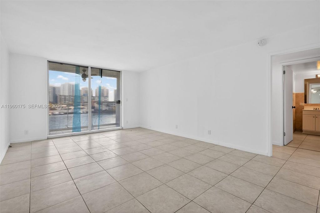 Photo of 100 Golden Isles Dr #406, Hallandale Beach, FL 33009 (MLS # A11960175)