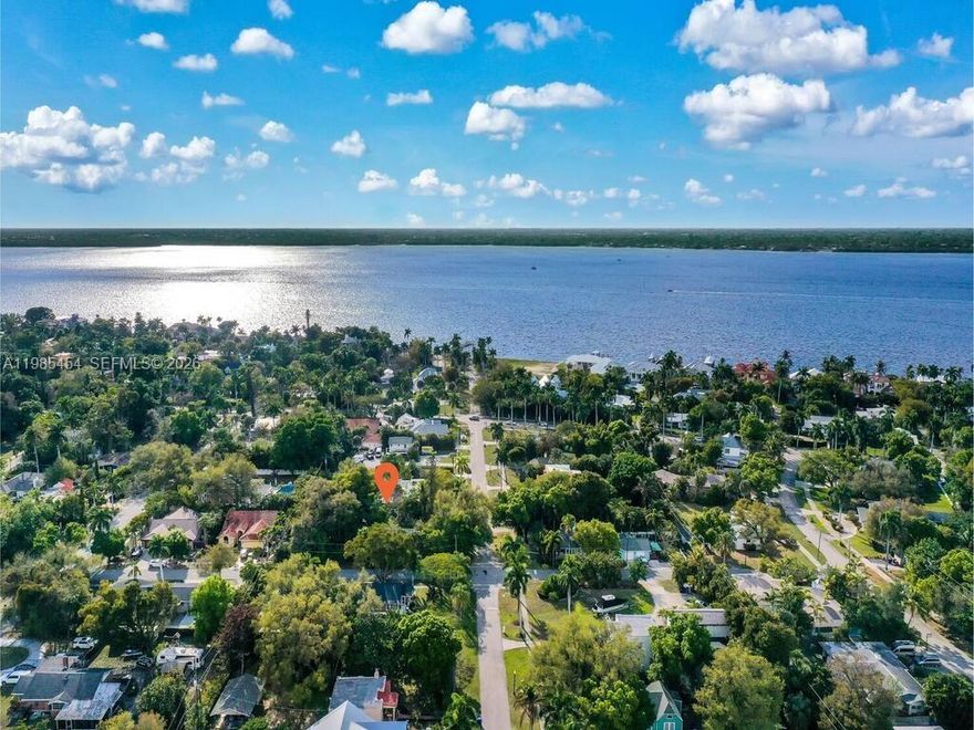 Discover a rare opportunity to own a charming river district residence that blends character, functionality and future potential in one of Fort Myers’ most desirable areas. This thoughtfully designed home offers two comfortable bedrooms plus a versatile den and a well appointed full bath, creating flexible living space for a home office, studio or additional lounge. Natural light fills the interior, enhancing a warm and inviting atmosphere with a practical layout for everyday living. The main living areas feature 100 year old original floors, impact windows and a working wood burning fireplace, combining historic charm with modern durability while providing a comfortable setting for relaxing or entertaining. The kitchen offers ample space to customize and enhance, making it an ideal canvas for buyers looking to add personal value and style. Situated on a generously sized homesite, the outdoor space allows room to expand, garden or create a private retreat, surrounded by mature landscaping that adds shade and character. Located just minutes from the historic river district, dining, shopping and waterfront parks, this property offers a quiet residential feel with convenient access to local amenities. Whether you are seeking a primary residence or a long term investment, this home delivers a strong combination of location, flexibility and potential in the Fort Myers market.