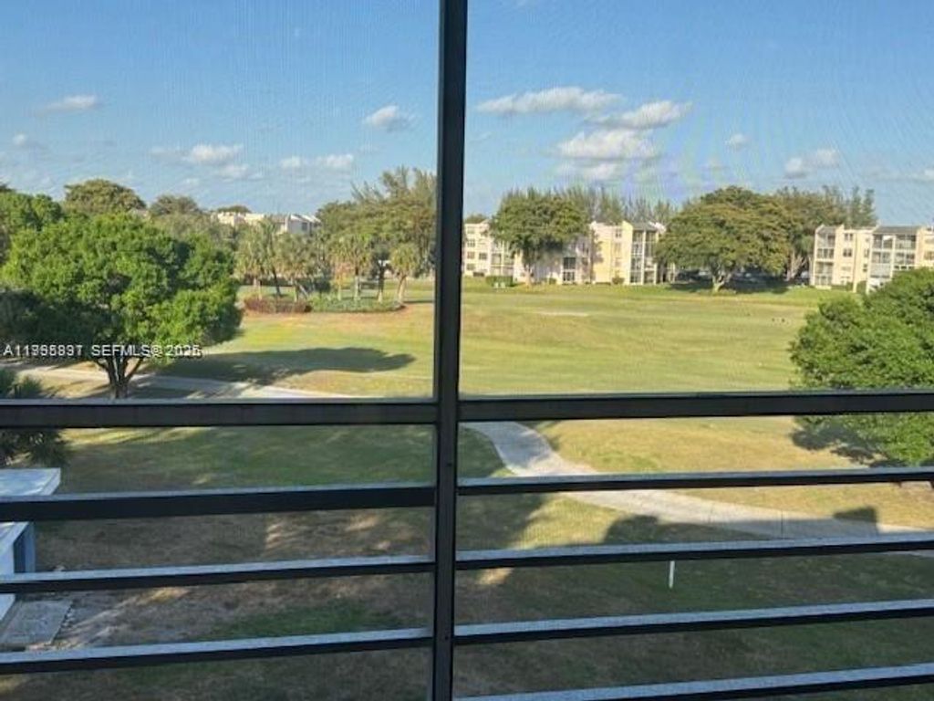 Photo of 9421 Evergreen Pl #403, Davie, FL 33324 (MLS # A11995897)